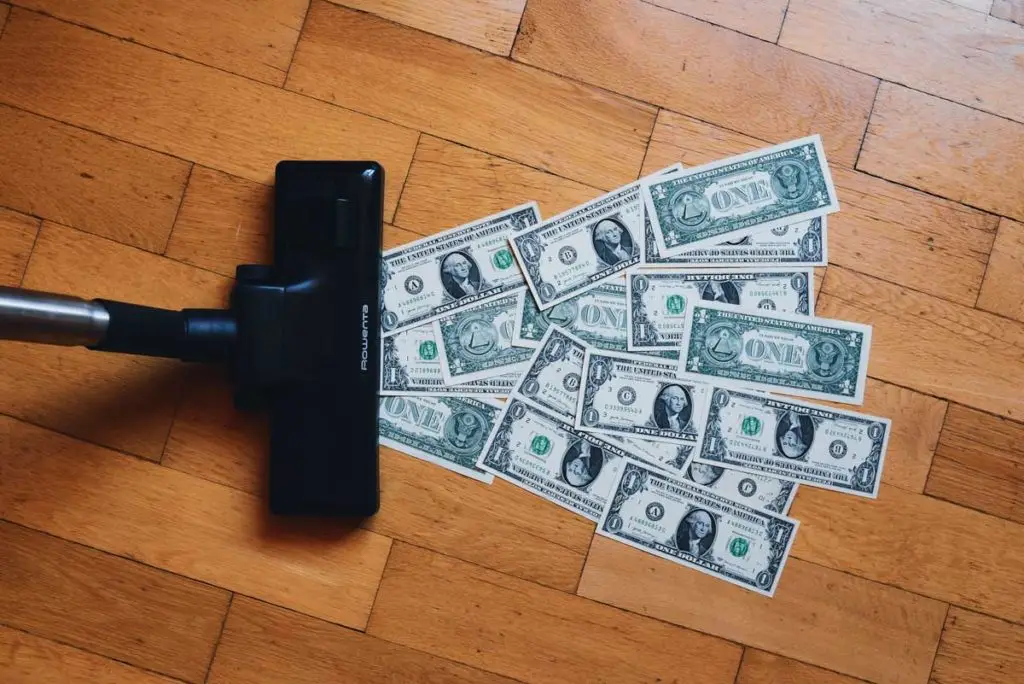 money being vacuumed|